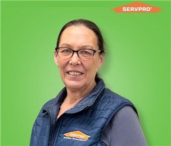 female employee wearing a blue SERVPRO vest