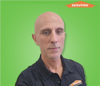 male employee wearing a black SERVPRO shirt